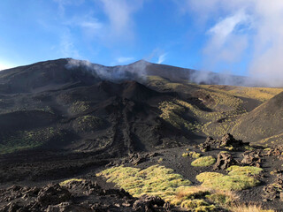 Scenic active European volcano Etna scenery with trenches laid by basalt bomb during eruption....