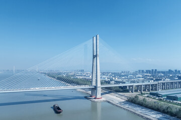 aerial view of high speed train passes the cable-stayed bridge