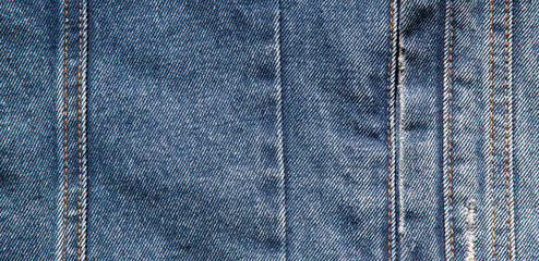 texture of blue jeans denim fabric wath seam background	