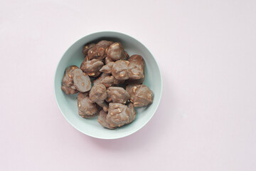 peanut chocolate candy on light color background 