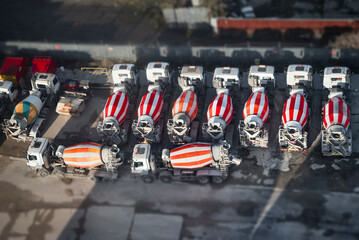 Naklejka na ściany i meble Parking Machines Concrete mixers white and red stripes, London, UK.