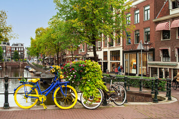 Fototapeta na wymiar Shot of bicycle decorated in the colors of the Ukrainian flag in honor of solidarity of Ukrainians in the Netherlands