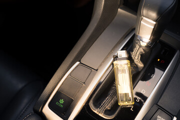 Lighter in car with sun light a long time. High heat temperature can explode and catch fire.