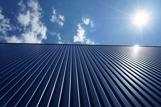 Fototapeta Low angle shot of a metal roof of a building on a sunny day