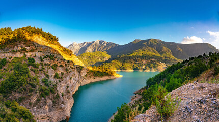 Fototapeta premium Beautiful picturesque landscape of the nature of a mountainous region with a gorge in which a lake is spread.