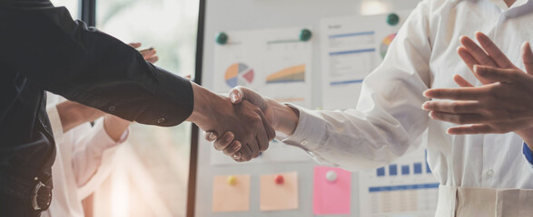 Business handshake and business people.Business people shaking hands,finishing up a meeting.