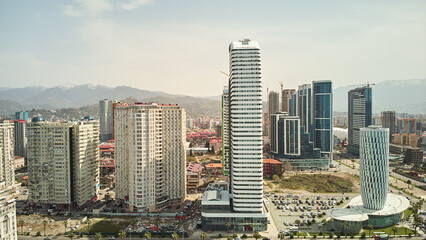 Obraz premium Aerial view of the modern architecture of Batumi with mountains background. High quality photo