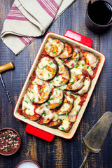 Baked eggplant with cheese mozzarella and tomatoes. Healthy eating. Italian food. Parmigiana di melanzane.