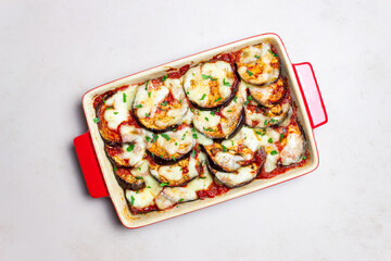 Baked eggplant with cheese mozzarella and tomatoes. Healthy eating. Italian food. Parmigiana di melanzane.