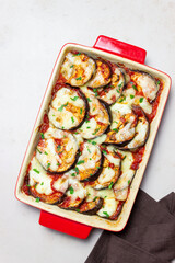 Baked eggplant with cheese mozzarella and tomatoes. Healthy eating. Italian food. Parmigiana di melanzane.