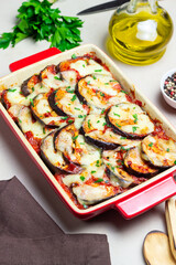 Baked eggplant with cheese mozzarella and tomatoes. Healthy eating. Italian food. Parmigiana di melanzane.