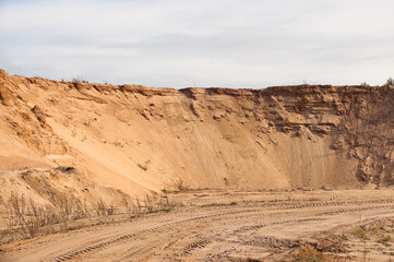 sand quarry, in the photo, a quarry for sand extraction against a gray sky