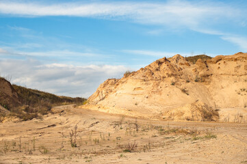 Fototapeta na wymiar sand quarry, in the photo, a quarry for the extraction of sand against a blue sky