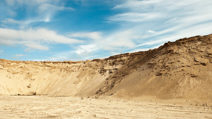 sand quarry, in the photo, a quarry for the extraction of sand against a blue sky