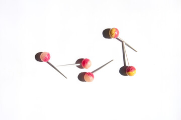 Lolipop candies lie on a white background. Top view, flat lay