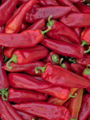 A bunch of freshly picked red peppers, view from above	
