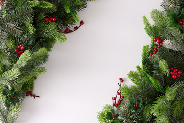 Naklejka na ściany i meble Holliday background made of fir branches with Christmas decorations. Minimal flat lay. Nature New Year concept.