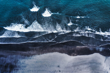 Moody atlantic ocean wave on black sand beach in summer at Iceland