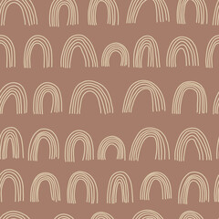 Boho rainbows seamless pattern. Hand drawn nursery rainbows illustration on brown background. Children's background. For textiles, clothing, bed linen, office supplies.