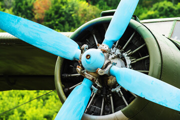 Fragment of an old aircraft with propeller and engine. Close up