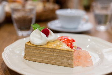 Slice of layer cake in coffee shop