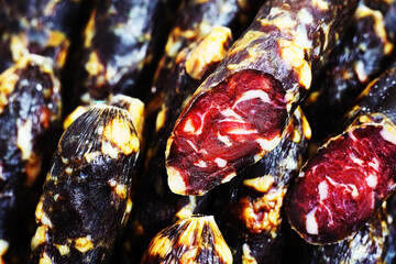 Horse sausage on the counter of a farm shop. Close-up