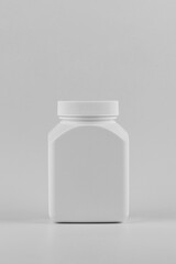 pills bottle or pills box or skincare and cosmetology vertical mockup with copy space. Unbranded white plastic flacon for cosmetics products or pills. Branding identity template for text and design