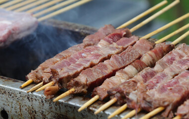 skewers of sheep and mutton cooked over the burning embers called ARROSTICINI in the Italian language