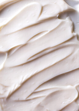 Surface with smooth creamy product. Beauty or food background. Top view.