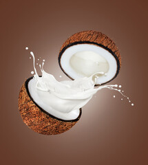 Two halves of a coconut with milk splashes on a brown background