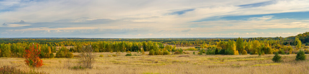 Large-format autumn panorama with fields and forests stretching beyond the horizon
