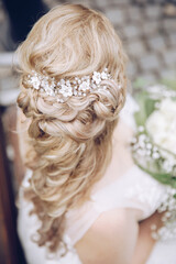 beautiful bridal hairstyle photographed from above. long blond hair with slight curls