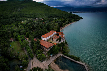Fototapeta na wymiar Monastery in the mountains overlooking the lake, top view