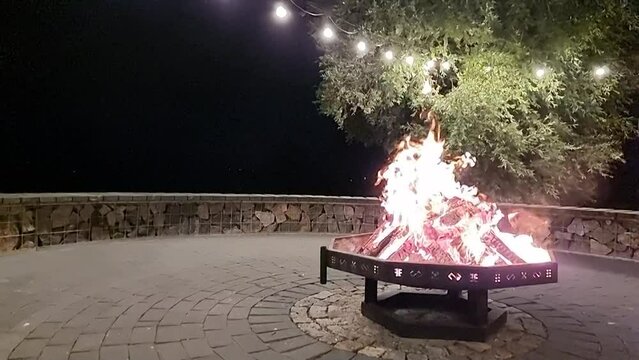 Slow motion burning fire at night with additional space for title, info or any kind of text