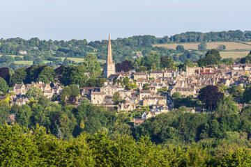 Fototapeta na wymiar Early morning light on Midsummers Day (June 21st) on the Cotswold town of Painswick, Gloucestershire , England UK