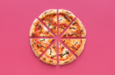 Sliced pizza top view on a magenta background. Wild mushrooms pizza