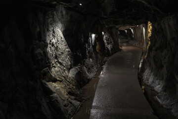 Dark tunnel of abandoned underground marble quarry