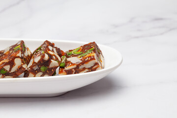 Close-Up Indian classical dry fruits and nuts barfi (sweet or mithai) enriched with Fig, almond, Pistachio, khajoor ( dates), cashew nuts , On festivals, Diwali, Deepawali, Dussehra, Rakshabandhan, 