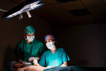 Doctors during operation in hospital operating room