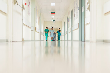 Medics and patient in hall