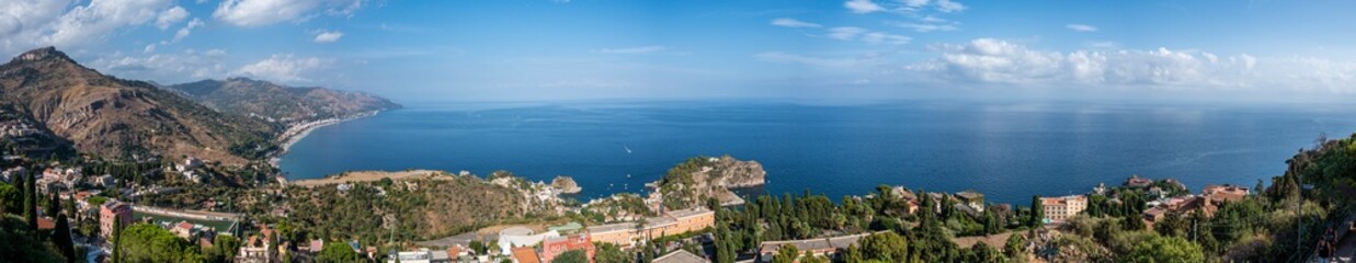 Naklejka na ściany i meble Aerial wide angle view of Taormina and its beautiful coastline