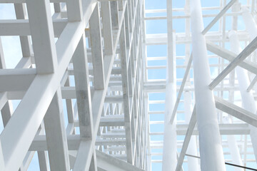 White Steel beam construction with blue sky background