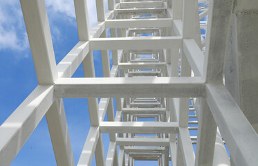 White Steel beam construction with blue sky background