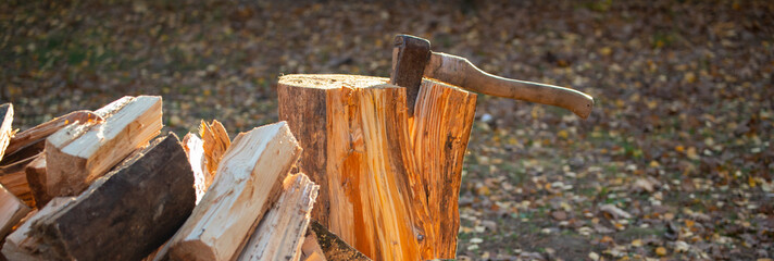 Chopping firewood for the winter. Fuel for the fireplace. Harvesting logs for heating the house.