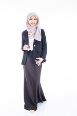 Portrait of Muslim woman in office attire and wearing a hijab. Asian woman in a corporate world. Formal corporate outfit and elegant appearance. Corporate or business people concept. Isolated