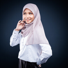 Close up portrait of Muslim woman in office attire and wearing a hijab. Asian woman in a corporate world. Formal corporate outfit and elegant appearance. Corporate or business people concept. Isolated