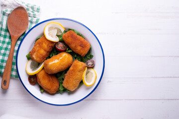 Fish croquettes. Traditional tapas of the coastal areas in Spain.