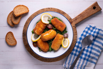 Fish croquettes. Traditional tapas of the coastal areas in Spain.