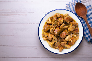 Braised pork with red wine sauce and mushrooms. Traditional northern Spanish tapas.