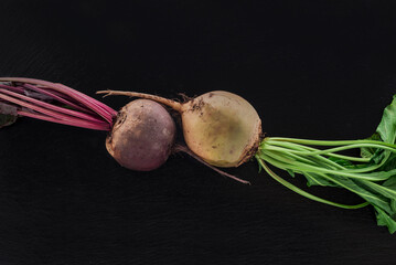 Beetroot on dark stone table. Top view. Vegetarian food concept.